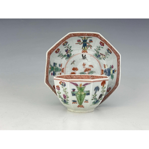 977 - A Worcester polychrome tea bowl and saucer, black workman's marks, circa 1753-55, octagonal from pai... 