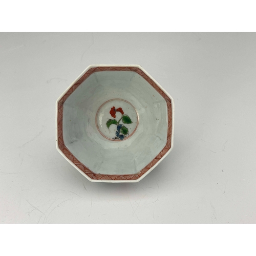 977 - A Worcester polychrome tea bowl and saucer, black workman's marks, circa 1753-55, octagonal from pai... 