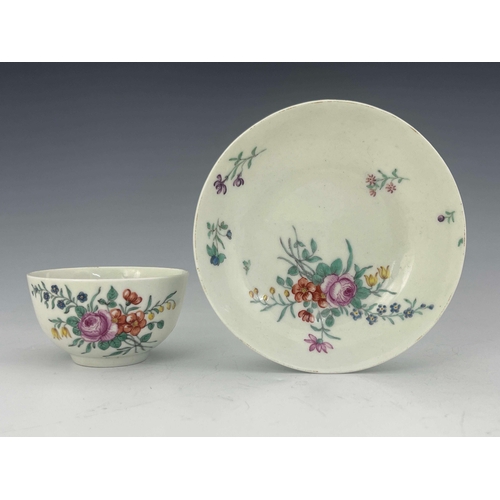 978 - A Worcester polychrome tea bowl and saucer, circa 1760, painted with floral bouquets and sprigs, 12c... 