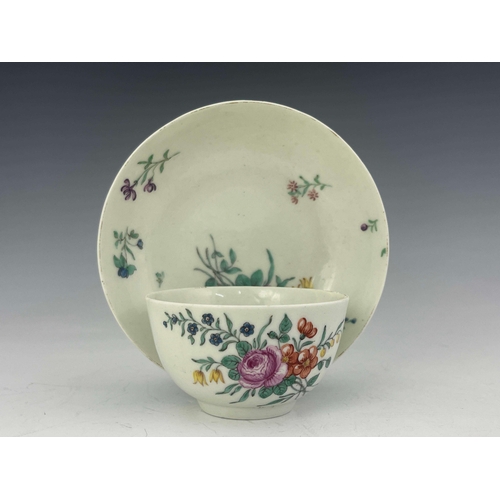 978 - A Worcester polychrome tea bowl and saucer, circa 1760, painted with floral bouquets and sprigs, 12c... 