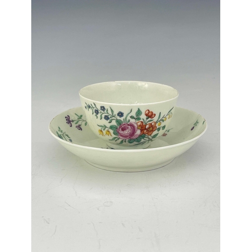 978 - A Worcester polychrome tea bowl and saucer, circa 1760, painted with floral bouquets and sprigs, 12c... 