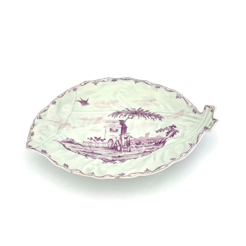 1005 - A Worcester monochrome leaf moulded dish, circa 1753-55, painted with an Oriental coastal scene of f... 