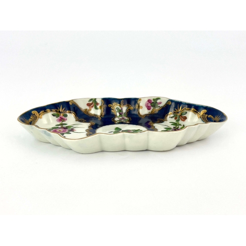 1007 - A Worcester scale blue tray, crescent mark, circa 1770, lobed navette form, painted with European fl... 