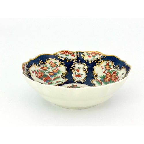 1008 - A Worcester scale blue bowl, square mark, circa 1770, double ogee form with serpentine rim, painted ... 