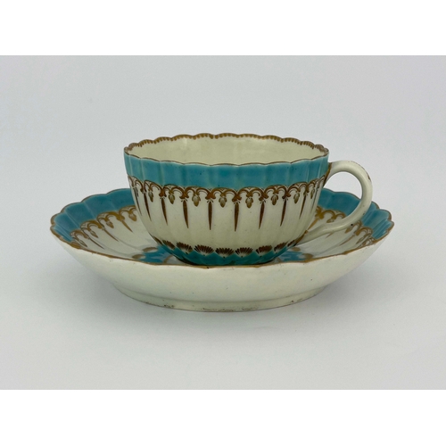 1024 - A Worcester enamelled and gilded tea cup and saucer, circa 1775, reeded and fluted, decorated with t... 