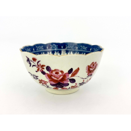 1028 - A Worcester underglaze blue and polychrome tea bowl, circa 1760, scalloped rim, painted in pink and ... 