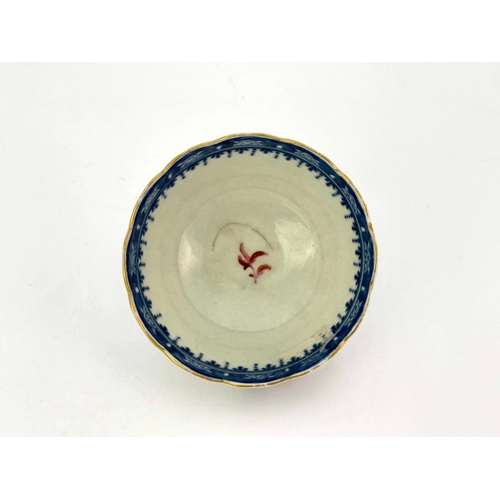 1028 - A Worcester underglaze blue and polychrome tea bowl, circa 1760, scalloped rim, painted in pink and ... 