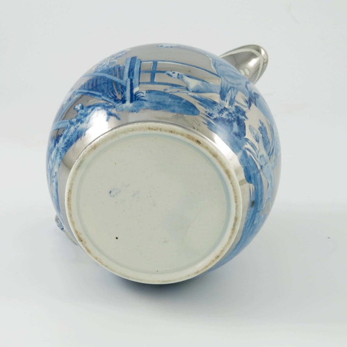 1085 - A silver lustre pearl ware pottery jug, globular form, circa 1815,  resist decorated with a blue and... 