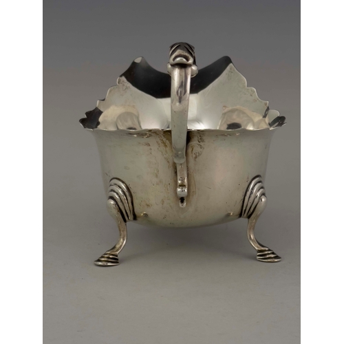 72 - A George V silver sauce boat, J B Chatterley and Sons, Birmingham 1927, ogee rimmed helmet form, ope... 