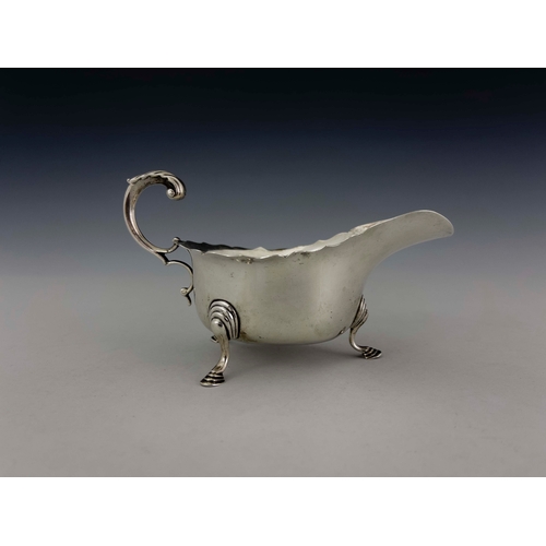 72 - A George V silver sauce boat, J B Chatterley and Sons, Birmingham 1927, ogee rimmed helmet form, ope... 