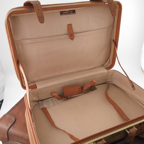 484 - Vintage Luggage, a John Pound & Co tan leather suitcase, early 20th Century, stitched with flush stu... 