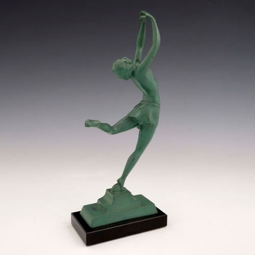 528 - An Art Deco patinated art metal figure of a dancer, circa 1925, modelled with arms raised, on black ... 