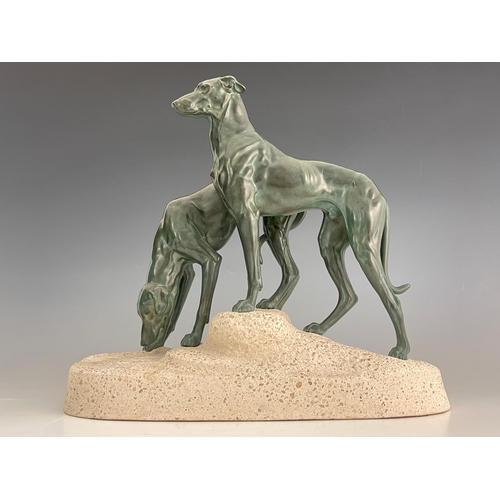 561 - Jules Edmond Masson, a patinated art metal figure group of two hounds, circa 1920, on naturalistic c... 