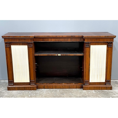 736 - A Regency rosewood low library bookcase, circa 1820, breakfront with beaded frieze, open recessed ce... 