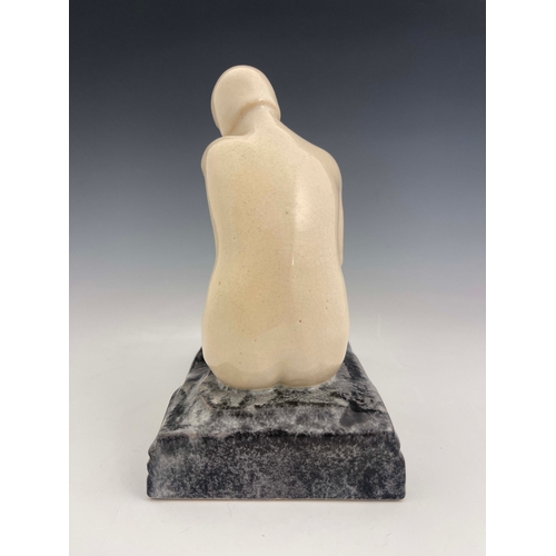 865 - L Rossat for Marcel Guillard, an Art Deco ceramic figure of a nude woman, circa 1930, modelled sitti... 