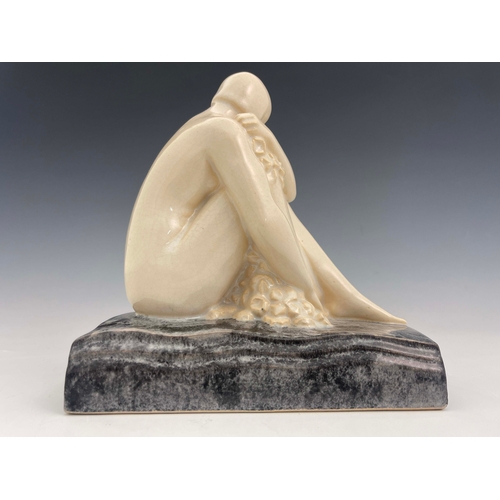 865 - L Rossat for Marcel Guillard, an Art Deco ceramic figure of a nude woman, circa 1930, modelled sitti... 