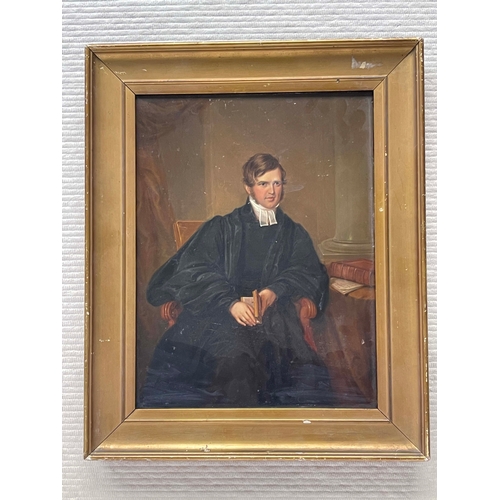 652 - James Leakey (British, 1775-1865), portrait of a young cleric, three quarter length seated in an int... 