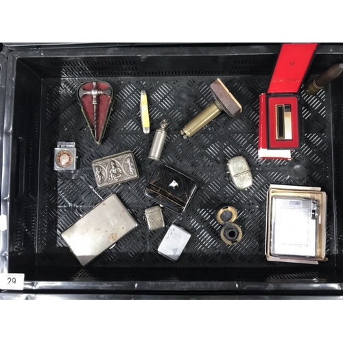 29 - A group of six lighters, one with Birmingham hallmarks, four cigarette cases, a novelty cased white ... 