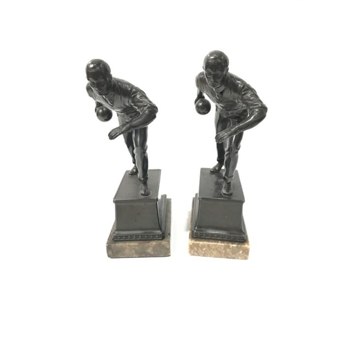 131 - A bronzed metal trophy, bowling figure on square plinth and marble base, with presentation inscripti... 