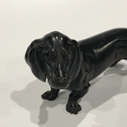 147 - An Austrian patinated cast bronze model of a Dachshund, bearing marks Geschutzt, 16cm long