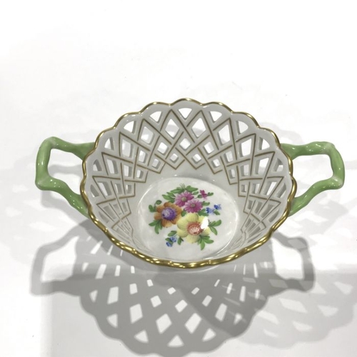 160 - A Herend Hungary twin handled pierced basket, floral motif to centre, 8cm high, together with a simi... 