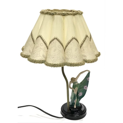 183 - An Art Deco table lamp, the porcelain figure of a dancing girl, wearing a long flowing green dress p... 