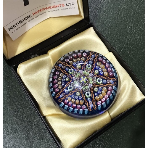 190 - A Perthshire Limited Edition millefiori cane and cog star pattern paperweight, with coloured twist b... 