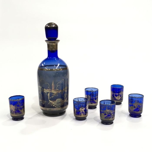 407 - A Venetian blue glass and lustre liqueur decanter and six glasses, decorated with Venice landmarks. ... 