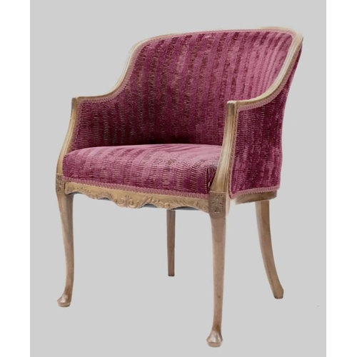 856 - A Regency style tub chair, purple textured upholstery, on shaped and sabre supports and pad feet.