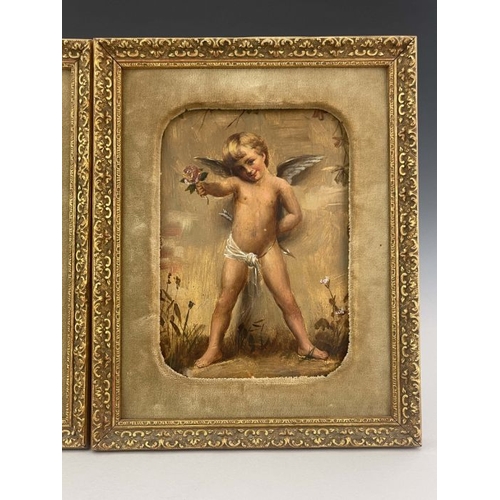 209 - A pair of Goldscheider wall plaques, late 19th Century, each painted with a standing winged cherub, ... 