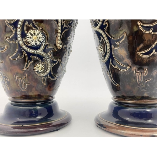 283 - George Tinworth for Royal Doulton, a pair of stoneware vases, circa 1903, footed and shouldered form... 