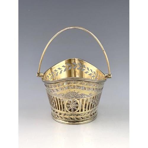 415 - A late Victorian silver swing handled bon-bon basket,  W. Co,  London 1891,  boat shaped, with an un... 