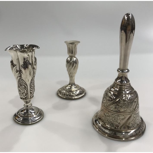 423 - A collection of Victorian and later silver, including a silver commemorative table bell, a taper sti... 