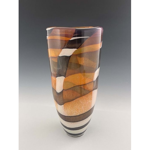 441 - A contemporary studio glass vase, cylindrical form, decorated with brown, black and white patchwork ... 