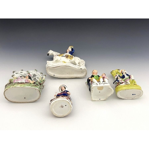 453 - A group of five 19th Century Staffordshire pottery and porcelain figures, to include lovers under an... 