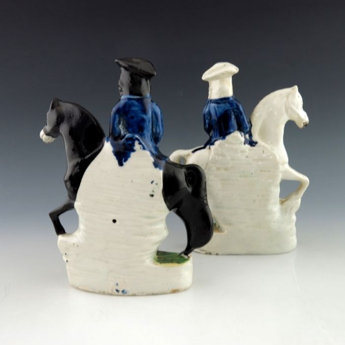 457 - A pair of 19th Century Staffordshire pottery flatback figures, Dick Turpin and his accomplice Tom Ki... 