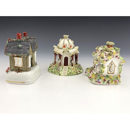 461 - Three 19th Century pastille burners, to include a Leeds Pottery creamware Regency cottage with veran... 