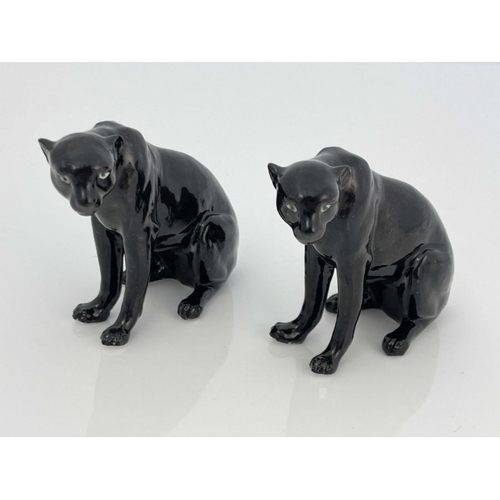 466 - A Royal Worcester pair of figurines, modelled as black panthers, printed marks, 9cm high (2)