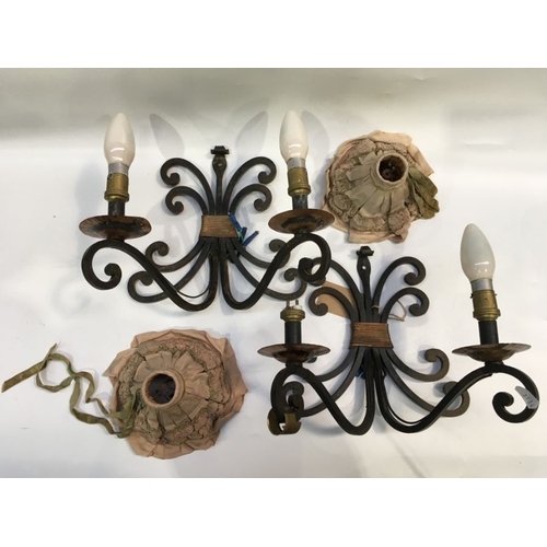 479 - A pair of iron wall mounted twin branch lights, scroll decoration, together with a pair of oval glas... 