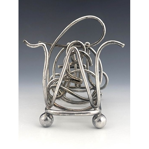 489 - A Victorian silver plated novelty toast rack, circa 1898, six division, the dividers in the form of ... 