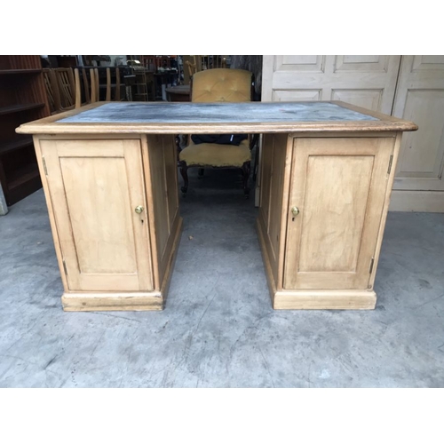 756 - A Victorian pine twin pedestal desk of railway interest, fitted drawers and cupboard doors, the moul... 