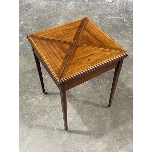 804 - An Edwardian mahogany, strung and crossbanded games table, circa 1910, retractable envelope top open... 