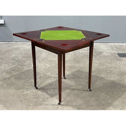 804 - An Edwardian mahogany, strung and crossbanded games table, circa 1910, retractable envelope top open... 