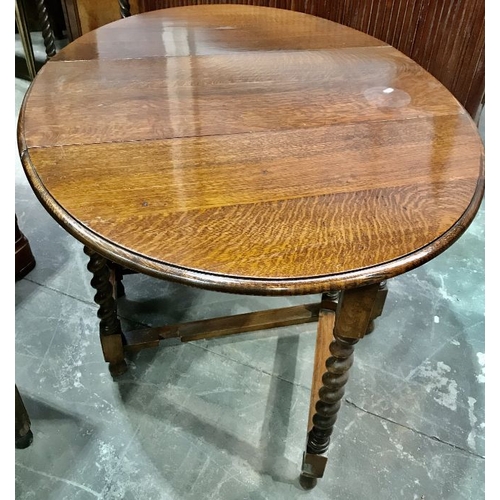 807 - An oak drop leaf occasional table 91cm deep x  72cm tall x 119cm wide.