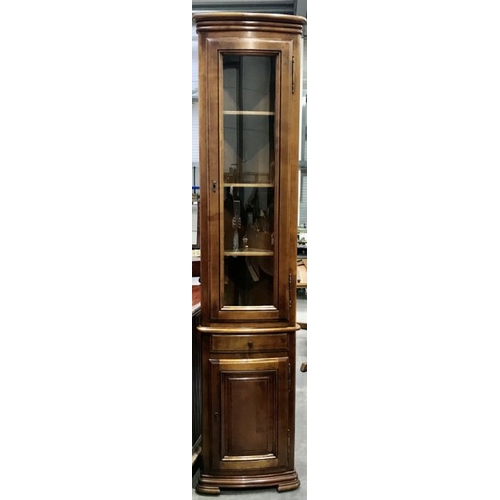 811 - A yew wood floorstanding corner display cabinet, 1240cm high, together with a floorstanding corner c... 