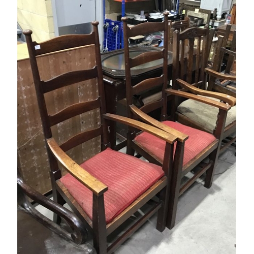 816 - A pair of oak Arts & Crafts ladderback armchairs, on block supports and stretchers  (2)