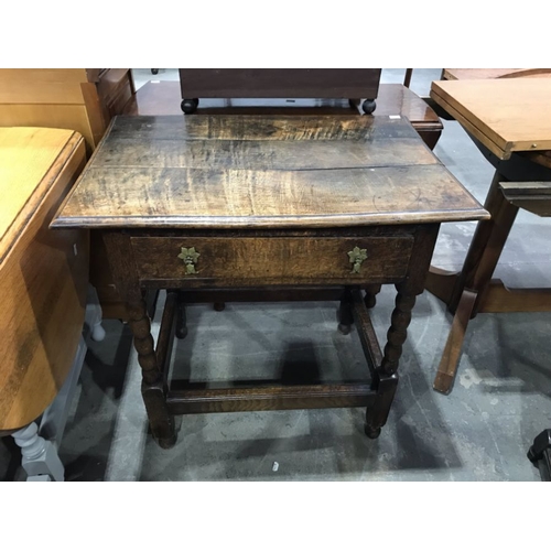 822 - An antique oak and side table, with planked tip, fitted single drawer on bobbin turned and block sup... 