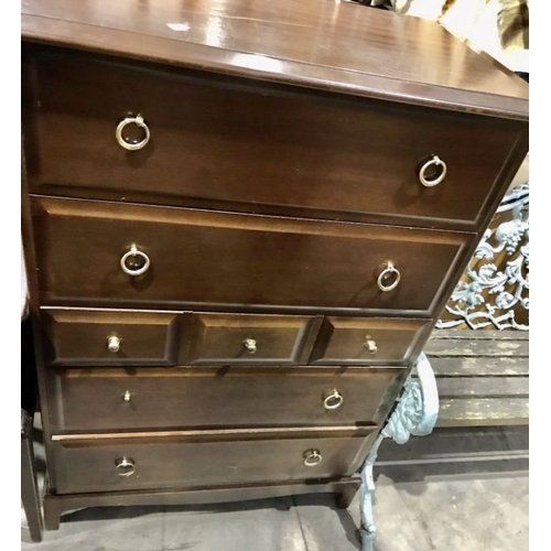 826 - A Stag Minstrel three piece bedroom suite, comprising two tall boys and a kneehole dressing table fi... 