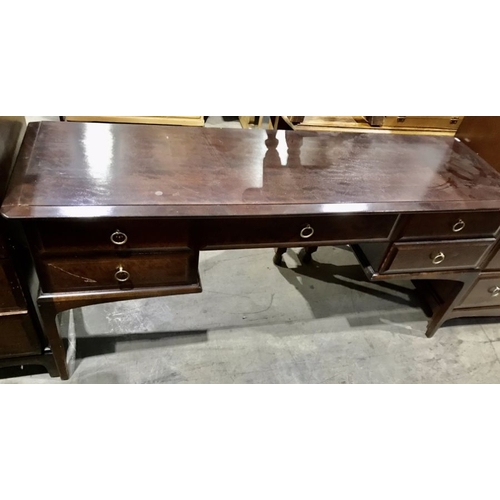 826 - A Stag Minstrel three piece bedroom suite, comprising two tall boys and a kneehole dressing table fi... 