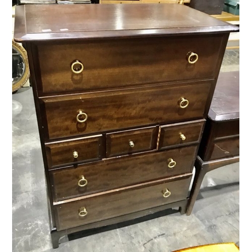 826 - A Stag Minstrel three piece bedroom suite, comprising two tall boys and a kneehole dressing table fi... 